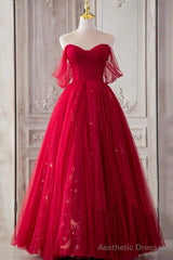 The Red Strapless Tulle Long A-Line Prom Dress is a showstopper. With its off-the-shoulder design and A-line silhouette, it perfectly blends elegance and allure.